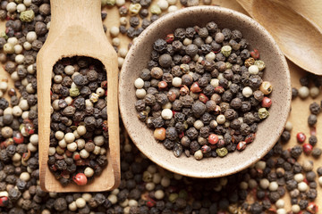 Colorful pepper in bowl and spoon
