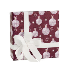 Dark red paper wrap white christmas baubles balls gift box silk ribbon bow isolated