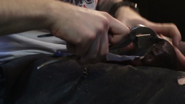 Making shoes. Shoemaker sews shoes.