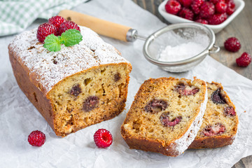 Sliced banana bread with raspberries, cherries and white chocolate, horizontal