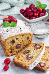 Sliced banana bread with raspberries, cherries and white chocolate