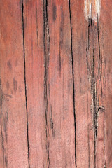 Old red wall with planks