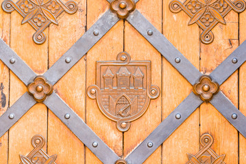 Closeup of brass handle of allwood door
