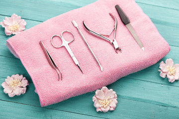tool for manicure on pink towel