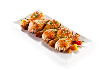 Roast chicken drumsticks and vegetables