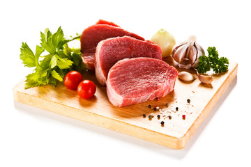 Fresh raw beef on cutting board on white background 