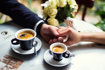 the couple holding hands
