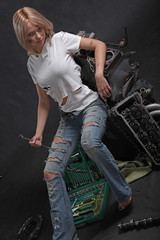 girl in engine oil with wrench key