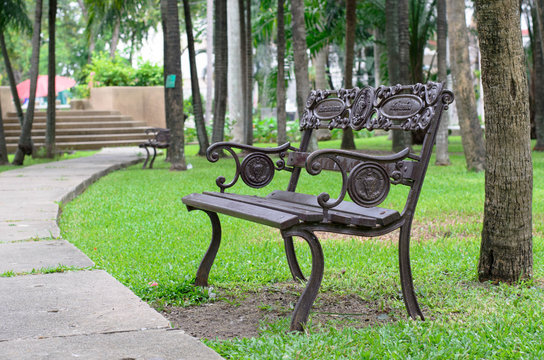 Stylish bench in summer park