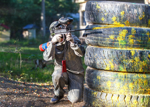 Shot from paintball gun. Flying ball with smoke trace behind.