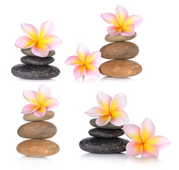 Obraz na płótnie Canvas set of zen stones with frangipani flower on white background
