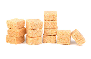 Cubes of cane sugar isolated on white background