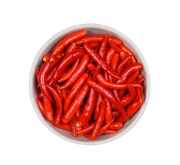 Top view Red chilli peppers in white bowl on white background