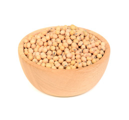 soy beans in wooden bowl on white background