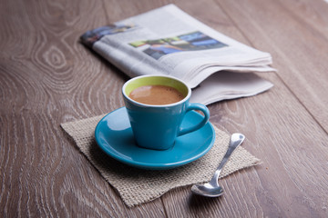 coffee and newspaper on desk