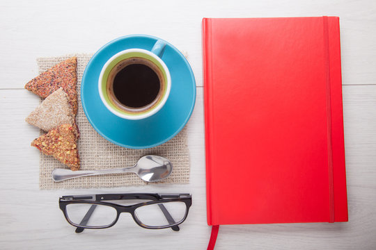 coffee cup with notebook