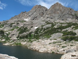 Alpine lake and jagged mountain peaks on hike to Blue Bird Lake in Rocky Mountain National Park