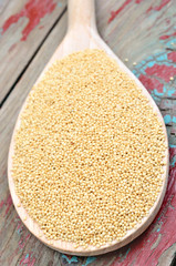 Amaranth seeds in a wooden spoon