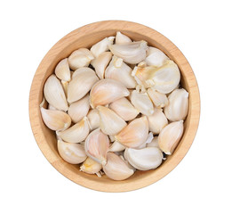 Top view Garlic cloves in wood bowl on white background