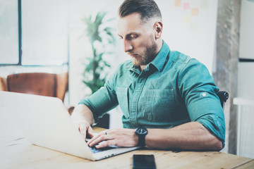 Fototapeta premium Social Trading Online Markets Analyze Reports.Men working wood table Modern Interior Design Meeting Room.Businessman Work Coworking Studio.Using Digital Tablet.Blurred Background Business Startup.