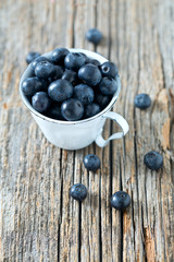 blueberries on wooden surface