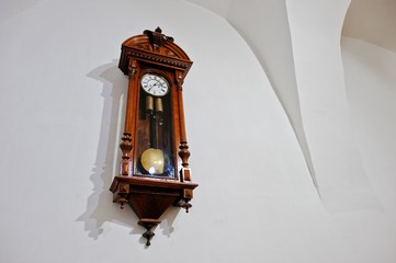 Vintage antique wood clock on wall