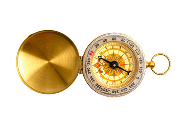 Close up, selective focus golden compass isolated on white backg