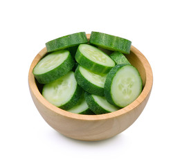 Fresh slice cucumber in wood bowl on white background