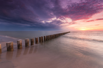 Wooden breakwater - Baltic seascape at sunset, Poland