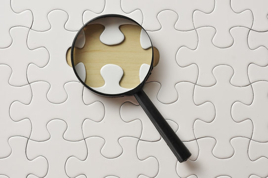Magnifying Glass On Missing Puzzle