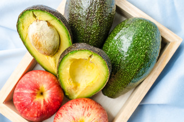 Close-up of sliced avocado on blue background