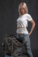 girl in engine oil with wrench key