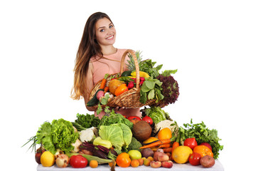 woman at the table with fruits and vegetables