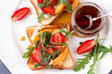 French toast with fresh strawberries and peaches