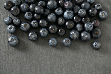 blueberries on stone board