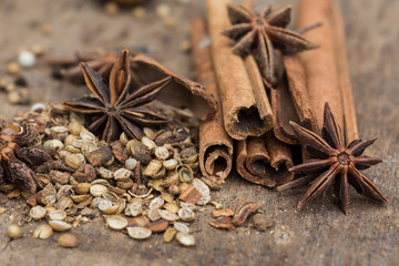 Spices lying on a wooden surface closeup