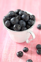 blueberries on wooden surface