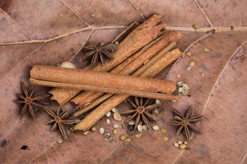 Spices lying on a wooden surface closeup
