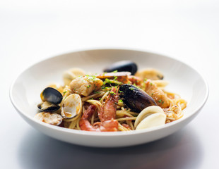 seafood and spicy puttanesca marinara tomato pasta
