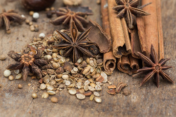 Spices lying on a wooden surface closeup