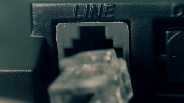 Hand connect a telephone line connector into the body of the phone