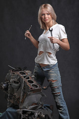 girl in engine oil with wrench key