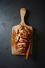 Roasted pork tenderloin on a chopping board