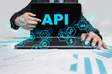 Businessman is pointing on virtual screen and selecting API.