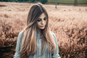 Beautiful and young girl in a man's shirt standing in the field.
shirt for the girl. Nature. Wind inflates hair. - 115460618