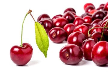 red cherry with leaf isolated on white background