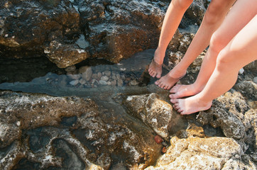Kids foot wading in sea