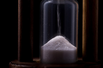 sand falling in hour glass