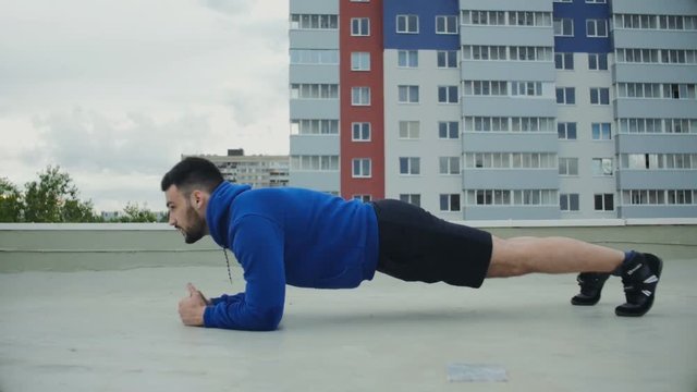Cinematic Plank Workout For Male Athlete On The Roof