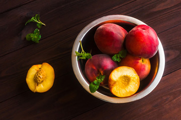 Fresh peaches on wooden background, top view, flat lay